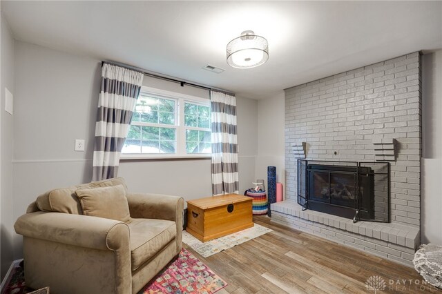 1817 El Camino Dr, Xenia, OH 45385 - living room with wood finished floors and a brick fireplace