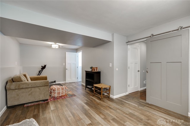 1817 El Camino Dr, Xenia, OH 45385 - living room with a barn door and wood finished floors