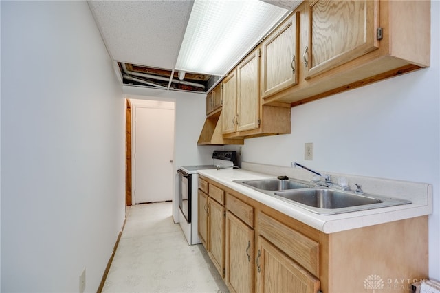 1817 El Camino Dr, Xenia, OH 45385 - kitchen with electric range, light brown cabinets, and light countertops