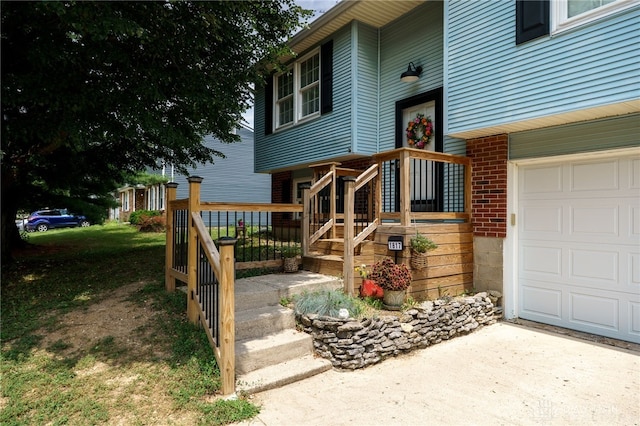 1817 El Camino Dr, Xenia, OH 45385 - entrance to property with driveway, brick siding, and a garage