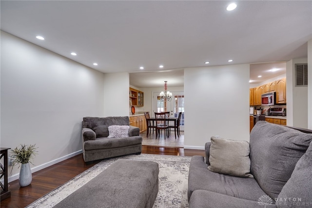 1817 El Camino Dr, Xenia, OH 45385 - living room featuring a chandelier, wood finished floors, and recessed lighting