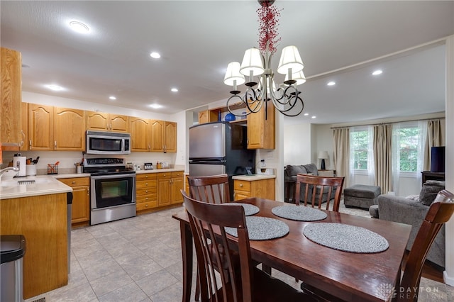 1817 El Camino Dr, Xenia, OH 45385 - dining room featuring a chandelier, recessed lighting, and light tile patterned floors