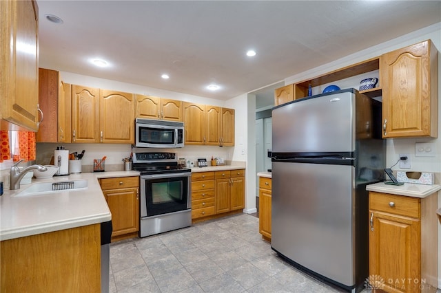 1817 El Camino Dr, Xenia, OH 45385 - kitchen featuring stainless steel appliances, light countertops, and recessed lighting
