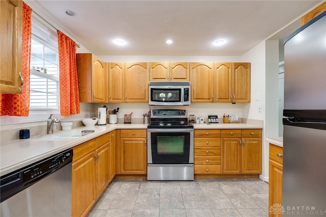 1817 El Camino Dr, Xenia, OH 45385 - kitchen featuring stainless steel appliances, light countertops, and recessed lighting