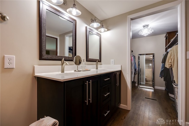 1817 El Camino Dr, Xenia, OH 45385 - bathroom featuring wood finished floors and double vanity