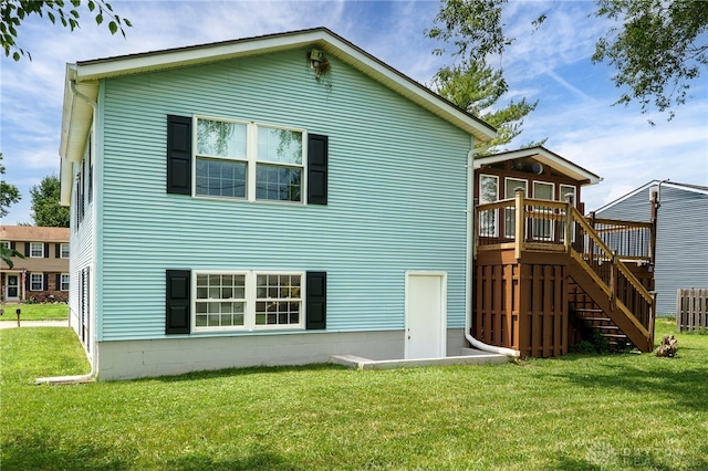 1817 El Camino Dr, Xenia, OH 45385 - back of house featuring a deck, a yard, and stairway