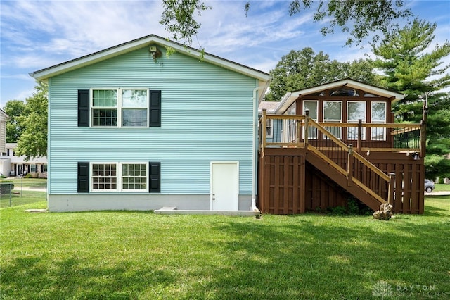 1817 El Camino Dr, Xenia, OH 45385 - rear view of property with a wooden deck, stairs, and a yard
