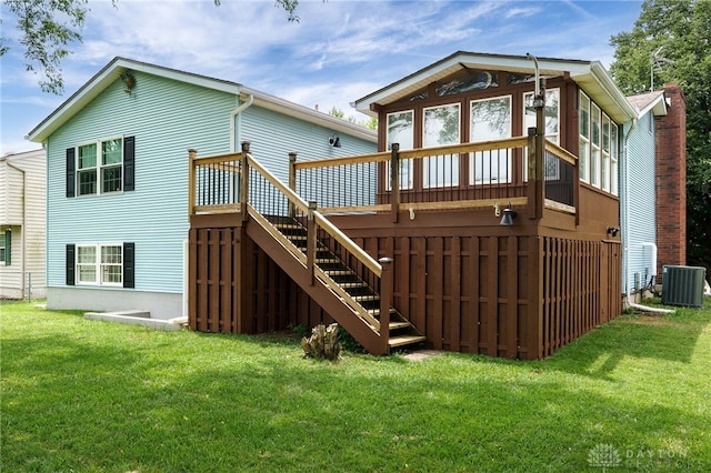1817 El Camino Dr, Xenia, OH 45385 - rear view of house featuring stairway, a deck, and a lawn