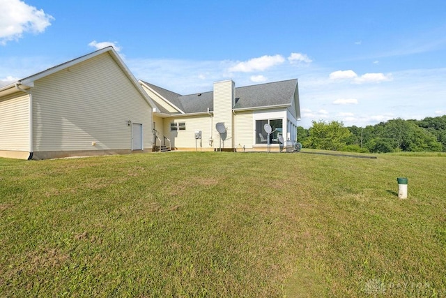 7373 Crowl Rd, Degraff, OH 43318 - rear view of property with a lawn and a chimney