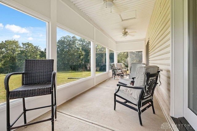 7373 Crowl Rd, Degraff, OH 43318 - sunroom with a ceiling fan and view of wooded area