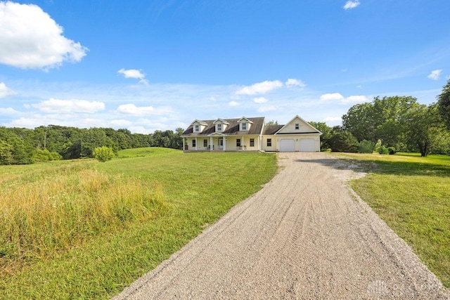 7373 Crowl Rd, Degraff, OH 43318 - cape cod-style house with driveway, a garage, and a front lawn