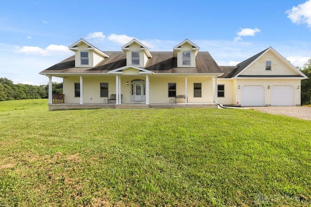 7373 Crowl Rd, Degraff, OH 43318 - view of front of home featuring covered porch, a front lawn, driveway, and a garage