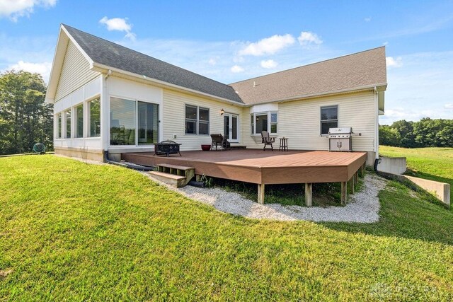 7373 Crowl Rd, Degraff, OH 43318 - rear view of house with a deck, a lawn, and roof with shingles