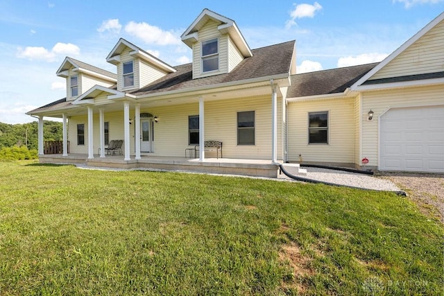 7373 Crowl Rd, Degraff, OH 43318 - view of front facade with covered porch, a front yard, an attached garage, and roof with shingles