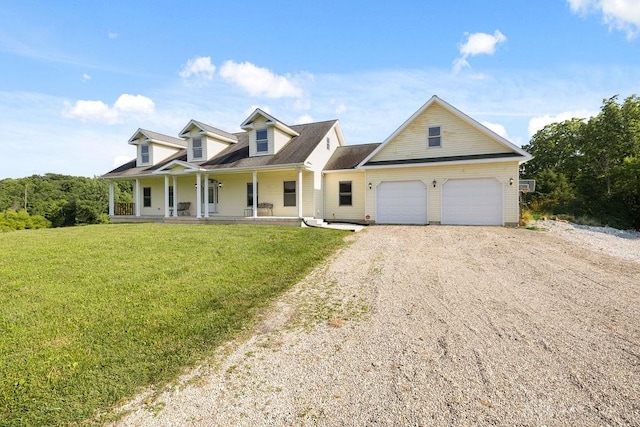 7373 Crowl Rd, Degraff, OH 43318 - new england style home featuring a porch, dirt driveway, a garage, and a front yard