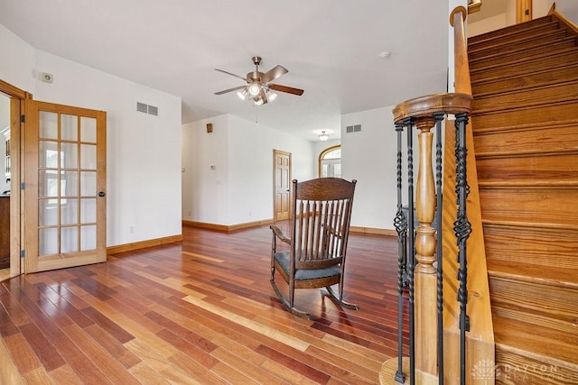 7373 Crowl Rd, Degraff, OH 43318 - staircase featuring ceiling fan and wood finished floors