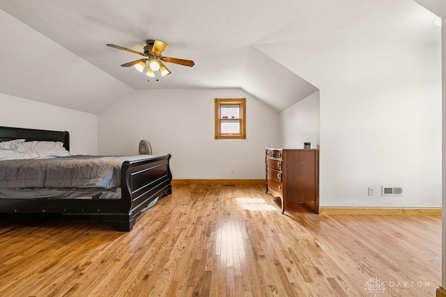 7373 Crowl Rd, Degraff, OH 43318 - bedroom with light wood-style floors, vaulted ceiling, and ceiling fan