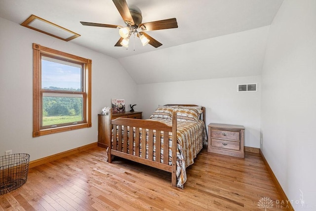 7373 Crowl Rd, Degraff, OH 43318 - bedroom with attic access, vaulted ceiling, wood finished floors, and ceiling fan