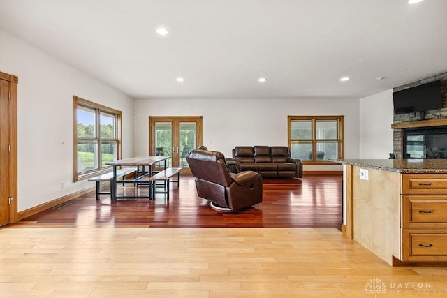 7373 Crowl Rd, Degraff, OH 43318 - living room with light wood-type flooring, recessed lighting, and a fireplace