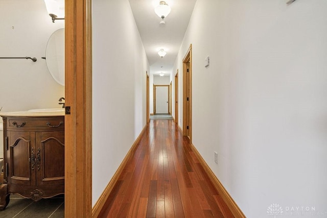 7373 Crowl Rd, Degraff, OH 43318 - hall featuring dark wood-style flooring and baseboards