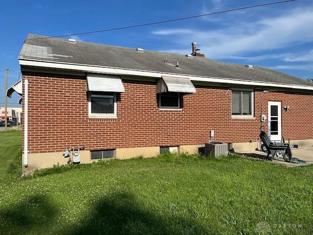 5747 N Springboro Pike, Dayton, OH 45449 - rear view of house with a lawn and roof with shingles
