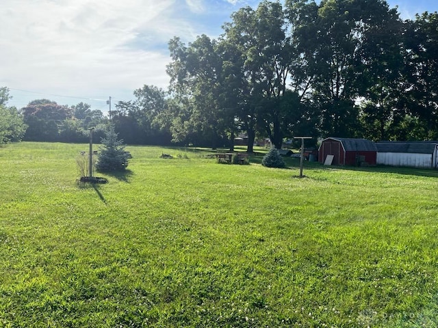 5747 N Springboro Pike, Dayton, OH 45449 - view of grassy yard featuring an outdoor structure