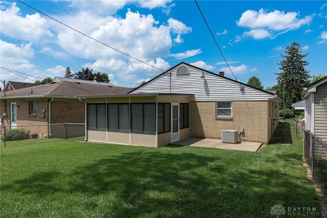 1716 Pershing Blvd, Dayton, OH 45420 - rear view of property with brick siding, a fenced backyard, a patio, and a sunroom
