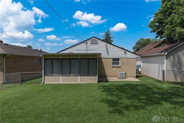 1716 Pershing Blvd, Dayton, OH 45420 - rear view of property with a patio, a sunroom, and brick siding