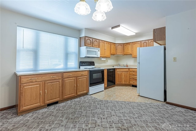 1716 Pershing Blvd, Dayton, OH 45420 - kitchen featuring white appliances, a chandelier, light countertops, and brown cabinets