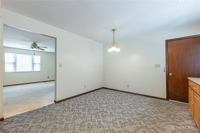 1716 Pershing Blvd, Dayton, OH 45420 - empty room featuring light carpet, a ceiling fan, and a chandelier