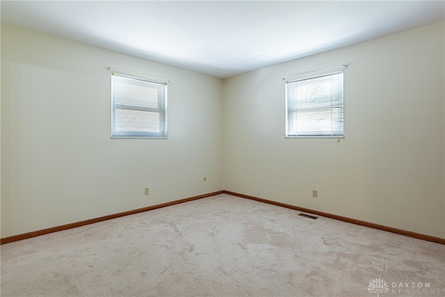 1716 Pershing Blvd, Dayton, OH 45420 - carpeted empty room with healthy amount of natural light