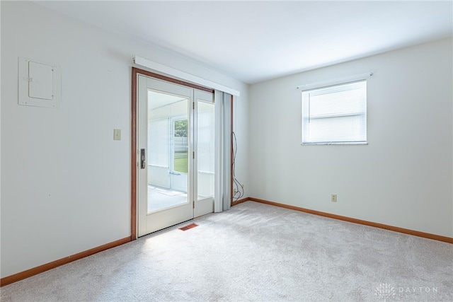 1716 Pershing Blvd, Dayton, OH 45420 - empty room with electric panel, healthy amount of natural light, and light carpet