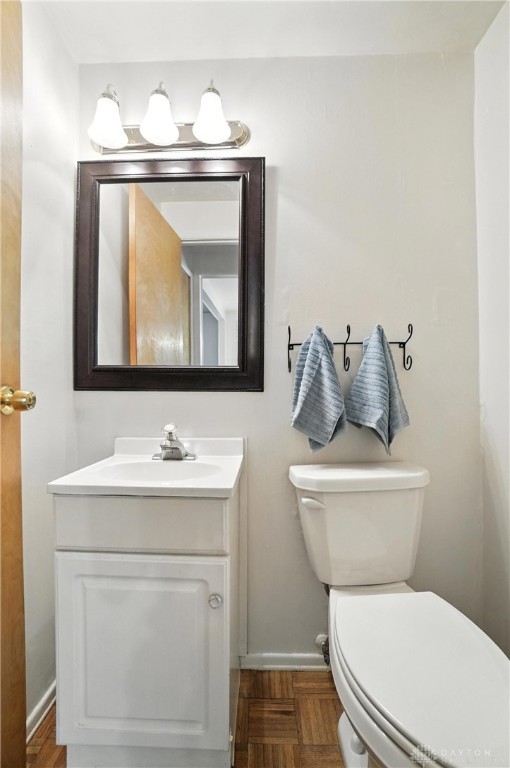 3811 Berryleaf Ct, Dayton, OH 45424 - half bathroom featuring vanity and toilet