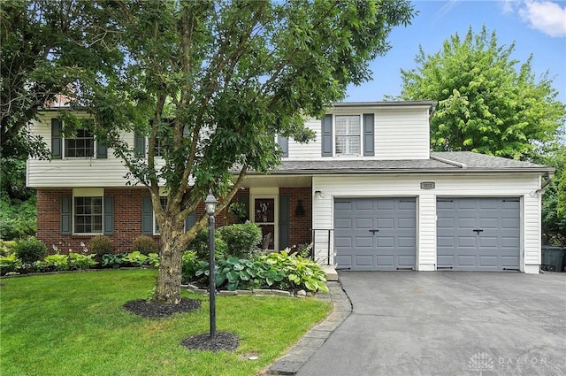 3811 Berryleaf Ct, Dayton, OH 45424 - view of front of home with a front lawn, driveway, and brick siding