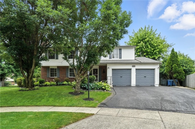 3811 Berryleaf Ct, Dayton, OH 45424 - view of front of house featuring asphalt driveway, a garage, and brick siding