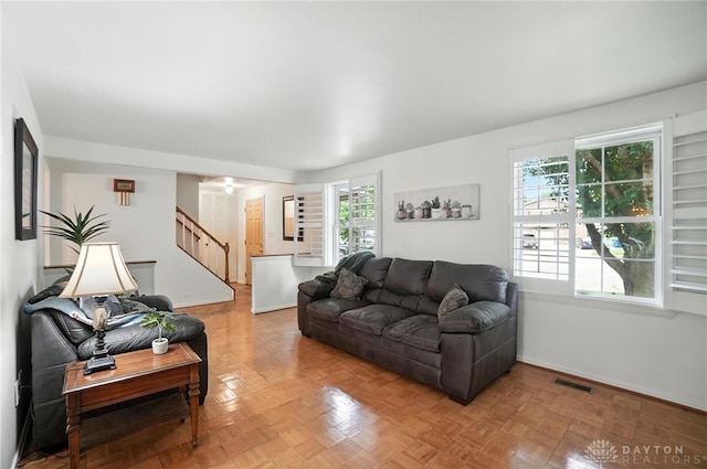 3811 Berryleaf Ct, Dayton, OH 45424 - living area featuring stairway and baseboards
