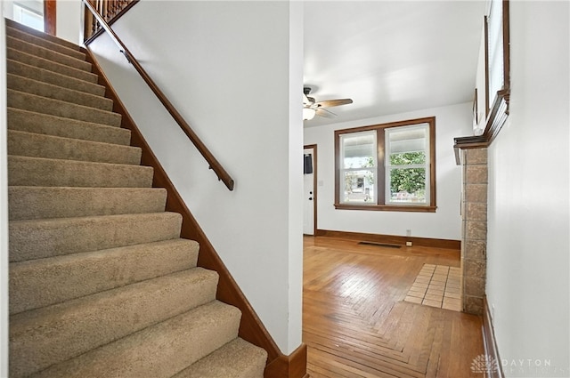 7336 Maple Ave, Cincinnati, OH 45231 - stairway featuring ceiling fan and wood-type flooring