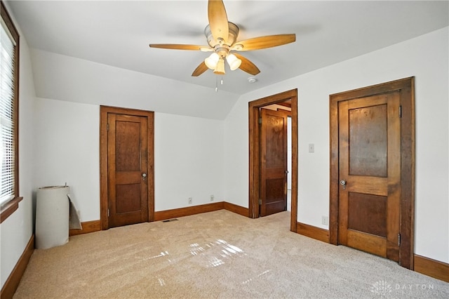 7336 Maple Ave, Cincinnati, OH 45231 - unfurnished bedroom with lofted ceiling, carpet, and a ceiling fan