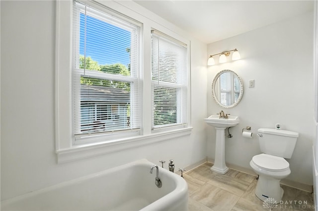 7336 Maple Ave, Cincinnati, OH 45231 - bathroom featuring a bathtub and plenty of natural light