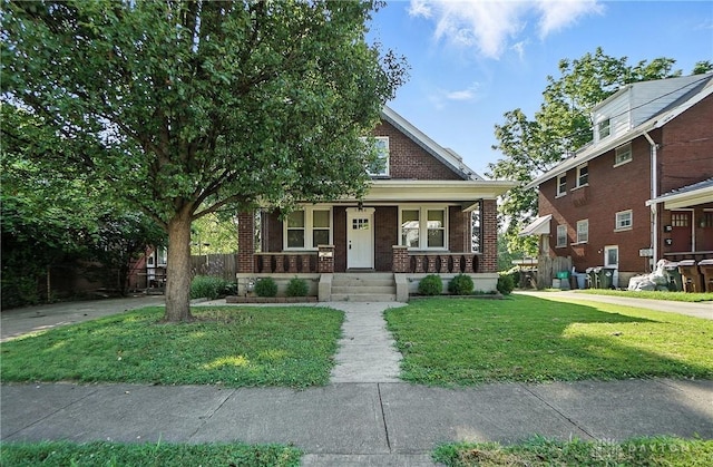 7336 Maple Ave, Cincinnati, OH 45231 - view of front of house featuring brick siding and a porch
