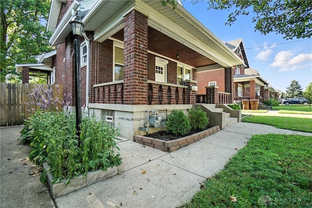 7336 Maple Ave, Cincinnati, OH 45231 - view of side of home featuring brick siding and covered porch