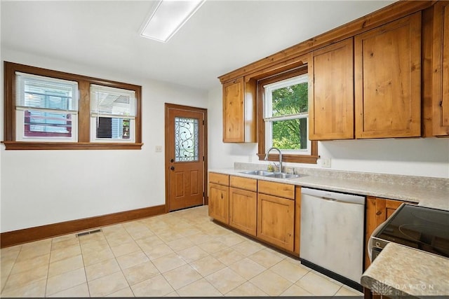 7336 Maple Ave, Cincinnati, OH 45231 - kitchen featuring stainless steel dishwasher, brown cabinets, light countertops, range with electric stovetop, and light tile patterned floors