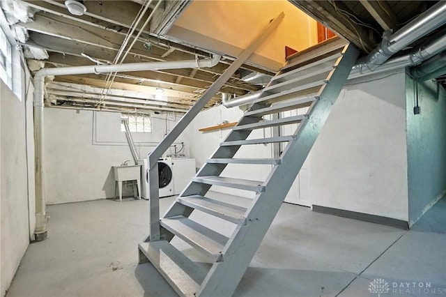 7336 Maple Ave, Cincinnati, OH 45231 - basement featuring washing machine and clothes dryer and stairs