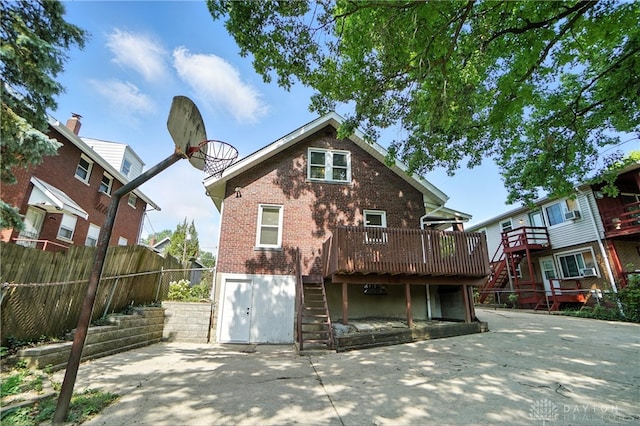 7336 Maple Ave, Cincinnati, OH 45231 - back of property featuring stairway, a deck, and brick siding