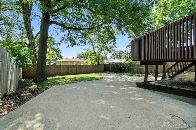 7336 Maple Ave, Cincinnati, OH 45231 - fenced backyard featuring a patio, stairway, and a deck