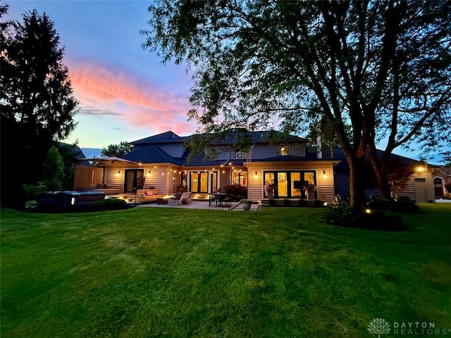 525 Heatherwoode Cir, Springboro, OH 45066 - rear view of house with a lawn and a patio area