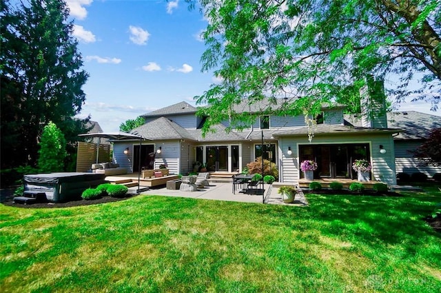525 Heatherwoode Cir, Springboro, OH 45066 - back of house featuring an outdoor living space, a yard, a patio, and a chimney