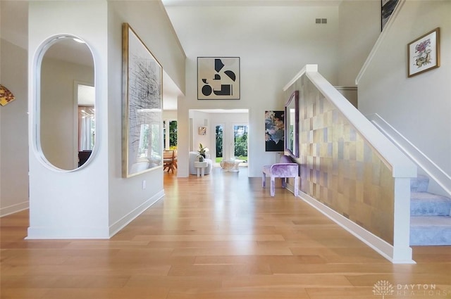 525 Heatherwoode Cir, Springboro, OH 45066 - entryway featuring wood finished floors, stairs, and arched walkways
