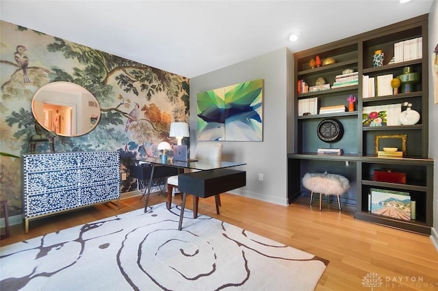 525 Heatherwoode Cir, Springboro, OH 45066 - home office with wallpapered walls, an accent wall, and wood finished floors