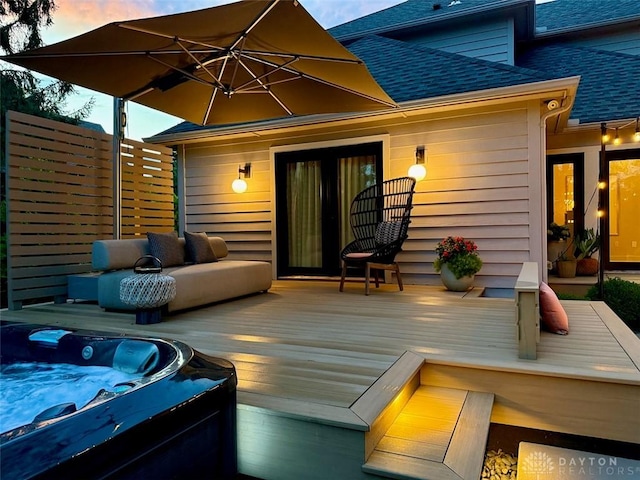 525 Heatherwoode Cir, Springboro, OH 45066 - deck at dusk with an outdoor hot tub